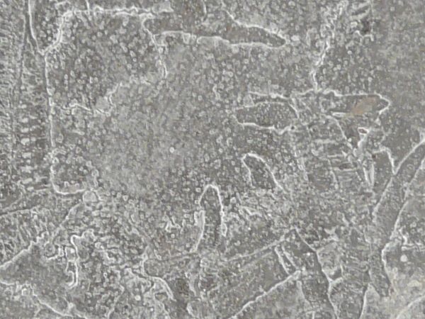 Cracked ice texture with small white air bubbles and cracks in the surface.